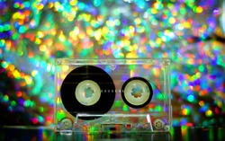 Audio tapes for tape recorder 70s 80s 90s bokeh vintage fashion old retro wallpaper background texture closeup nostalgia music sound style trend party dance disco