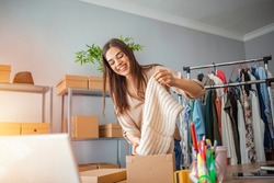 Woman Running Business From Home. Shipping shopping online, young start up small business owner packing cardboard box at workplace. Online selling or e-commerce.