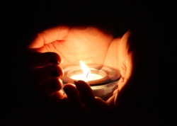 Candle in the hands