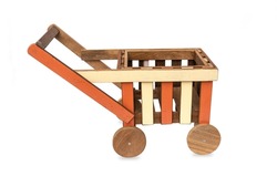 Handmade small wooden cart with four wheels painted putting items for decoration in the garden isolated on white background.