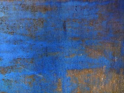 Corroded metal background. Rusted blue painted metal wall. Rusty metal background with streaks of rust. Rust stains. The metal surface rusted spots. Rystycorrosion.
