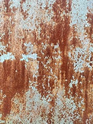 Corroded metal background. Rusted white painted metal wall. Rusty metal background with streaks of rust. Rust stains. The metal surface rusted spots. Rystycorrosion.