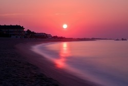 Beautiful sunrise over the Mediterranean Sea in Malgrat de Mar, Spain.