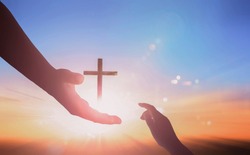 Jesus helping hand concept: World Peace Day Help hand on sunset background