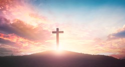 Easter concept: The cross on mountain sunset background