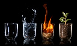 4 elements embodied as a concept in drinking glasses on black background, air, water, fire, earth