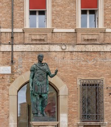 The statue of Julius Caesar in the Piazza Tre Martiri square in the historic center of Rimini, Emilia Romagna, Italy