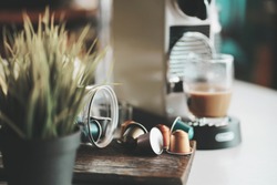 coffee machine,Espresso coffee capsules and Capsule coffee machines on white desk at office .selective focus                           