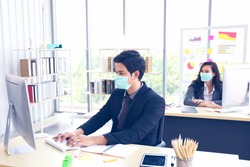 Businessman or office worker are working and wear mask for protect Covid-19 or corona virus disease but business must be continuous, healthcare concept 