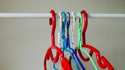 Colorful Plastic clothes hanger hang it on an empty clothesline.
