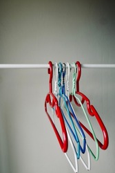 Colorful Plastic clothes hanger hang it on an empty clothesline.