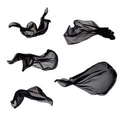 Black Fabric Cloth Flowing on Wind, Textile Wave Flying In Motion. Isolated on White background