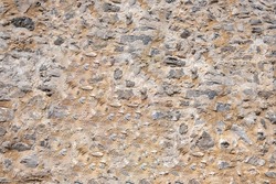 Stone wall texture background. Old stonewall traditional pattern building facade, natural material for cladding and flooring