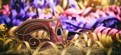 Carnival mask on colorful blur party background