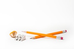 Two Pencils with pencil sharpener and sharpening shavings on white background. stationery. Office tool.