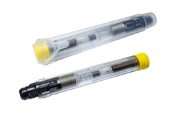 Two adrenaline auto-injectors in a plastic container and without it. Healthcare and medication