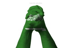 Man clasped hands patterned with the SAUDI ARABIA flag
