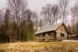Lonely log cabin on a hill. Abandoned, lonely, isolated. 