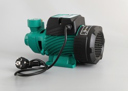 Vortex self-priming pump, side view, on a light gray background