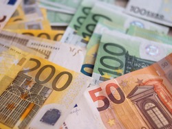 Euro Money Banknotes Photo Background. Two hundred euros, one hundred euros and fifty euros bills