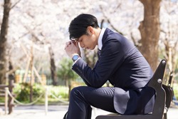 Japanese male businessmen who are troubled by worries