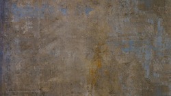 Old brown gray blue rusty vintage worn shabby patchwork motif tiles stone concrete cement wall texture background wallpaper