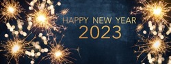 HAPPY NEW YEAR 2023, New Year's Eve Party background greeting card  - Sparklers and bokeh lights, on dark blue night sky