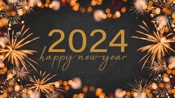 HAPPY NEW YEAR 2024 - Festive silvester New Year's Eve Party background greeting card - Frame made of orange fireworks in the dark black night.