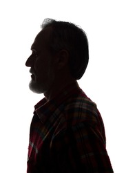 Portrait of a old man, unshaven, with beard, side view - dark isolated silhouette