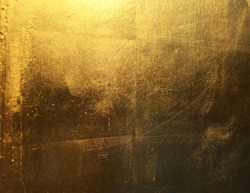 Gold abstract background with color shift from light to dark.