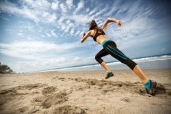 
Running woman, female runner jogging during outdoor workout on beach., fitness model outdoors.