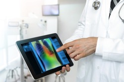 Artificial intelligence in smart healthcare hospital technology concept. Professional doctor use AI biomedical algorithm detect Pneumonia and cancer cell in digital filmless X-Rays process.