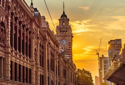 The clock tower of the Flinders Street Train Station in the city of Melbourne, Australia in the late afternoon sun