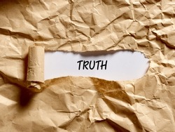 The word truth written under a brown torn paper. To reveal, expose, discover or display the hidden underlying truth concept.
