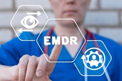 Doctor using virtual touchscreen presses abbreviation: EMDR. EMDR Eye Movement Desensitization Reprocessing medical concept. EMDR Therapy.