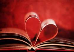 soft focused and colored book in shape of heart, book love concept 