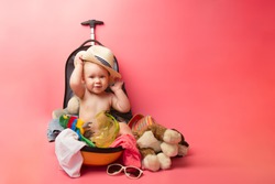 Baby on Travel Suitcase, Child Sit in Traveling Baggage, Kid into Vacation Luggage.Travel and adventure concept