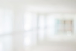 Empty corridor hallway of modern white office building room with glass entrance door business blur background, corridor in a bright room, empty space
