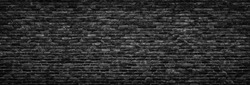 black brick wall background. dark stone texture