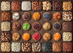 mix nuts and dried fruit on table background