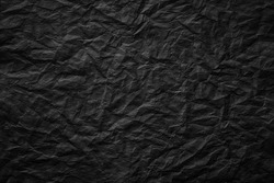 black crumpled paper background, rough page texture