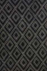 Diamond shape background, Seamless harlequin or argyle pattern made of black diamonds over white. Grid, mesh, lattice background with rhombus, diamond shapes. Blurry texture. Monochrome. 