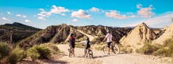 family mountain bike in desertic landscape