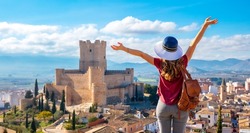 Atalya,Villena Castle in Costa Blanca Alicante Spain- woman tourist enjoying beautiful panoramic view