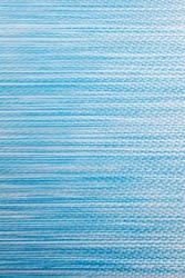 Fabric textured blue background. Fabric background of dense sun protection fabric used for the manufacture of fabric blinds.