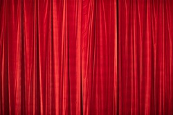 Red curtain in theatre. Textured background