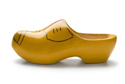  Single traditional yellow Dutch wooden shoe on white background