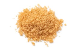 Heap of soft light brown sugar close up isolated on white background