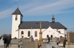 church and some crosses on the cemetery in Albrechticky, Czech Republic