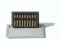 Metal abacus on white background.